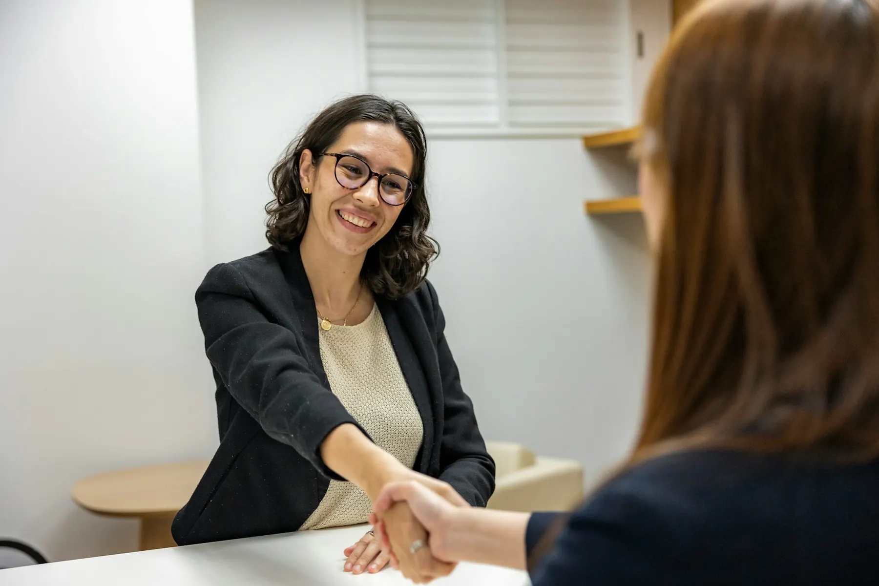 People discussing job opportunities around a table
