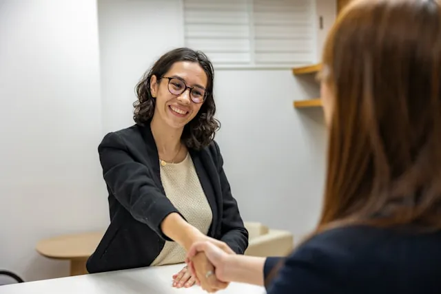 A recruiter welcoming a candidate