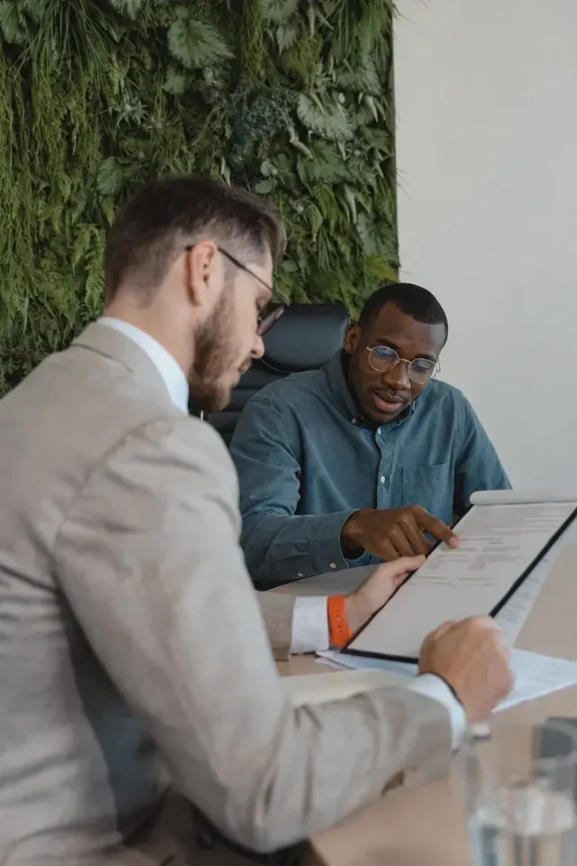 Two professionals reviewing a CV during an interview